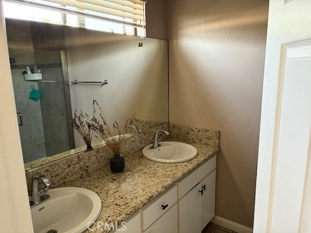 2249 Montrose Avenue, Unit 7 Montrose, CA 91020 - Photo 26 of 54 a bathroom with a granite countertop sink and a mirror
