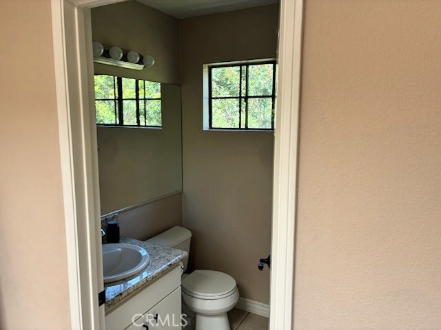 2249 Montrose Avenue, Unit 7 Montrose, CA 91020 - Photo 33 of 54 a bathroom with a granite countertop toilet and a sink