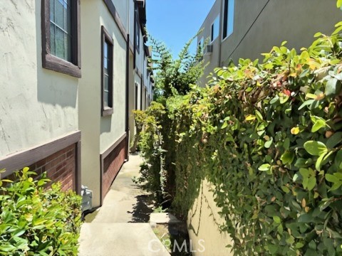 2249 Montrose Avenue, Unit 7 Montrose, CA 91020 - Photo 45 of 54 a bunch of flowers in front of yellow house