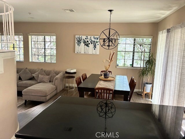 2249 Montrose Avenue, Unit 7 Montrose, CA 91020 - Photo 9 of 54 a living room with furniture a chandelier and a window