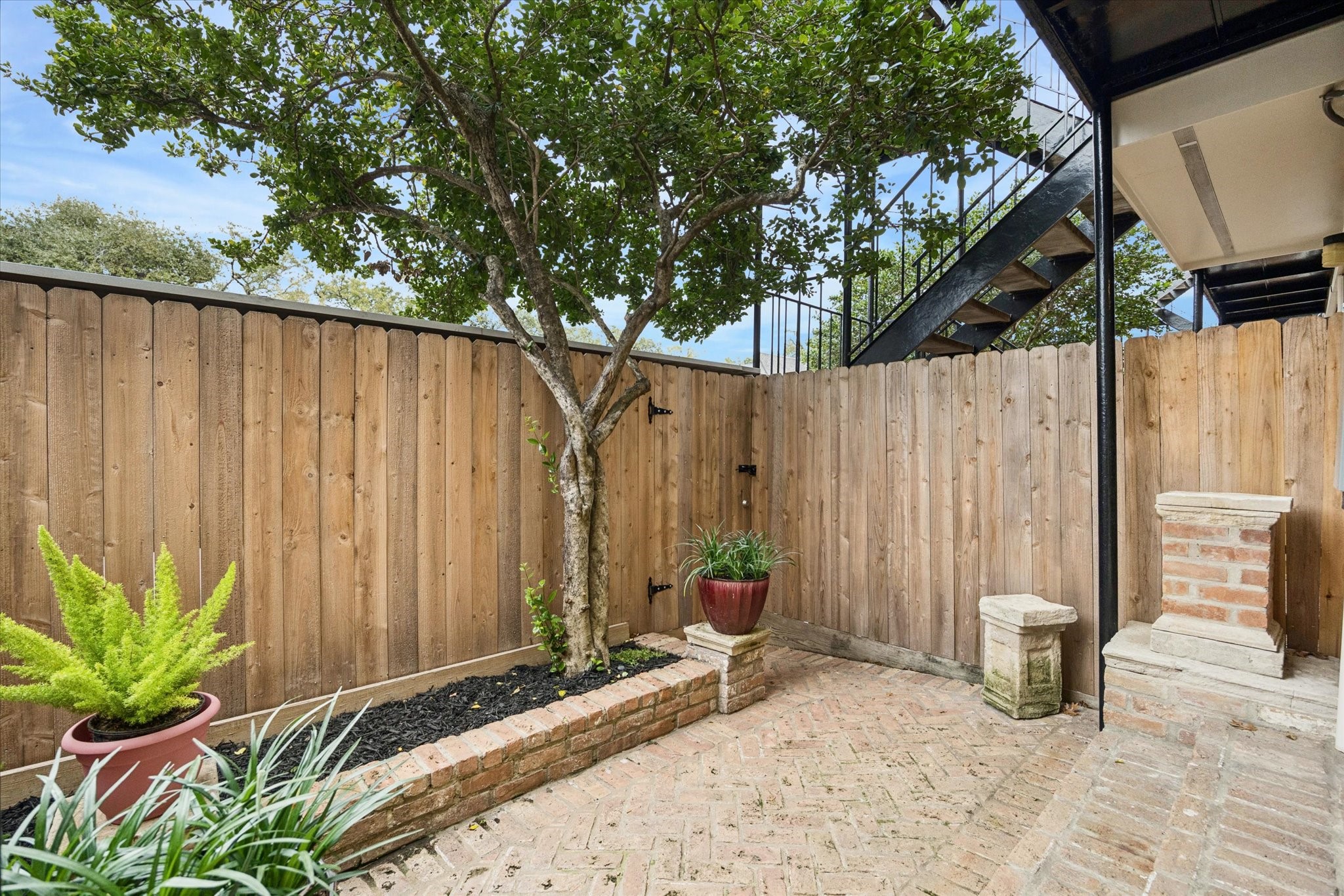 449 North Post Oak Lane, Unit 449 Houston, TX 77024 - Photo 14 of 18 Another view of the private fenced patio.