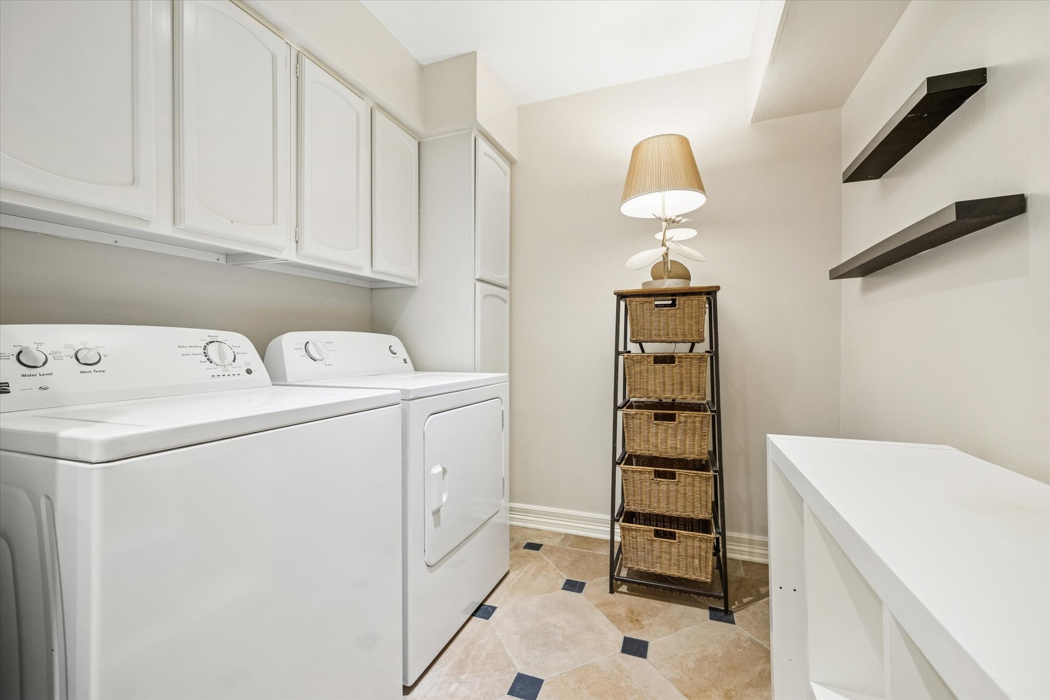 449 North Post Oak Lane, Unit 449 Houston, TX 77024 - Photo 9 of 18 Full size washer and dryer located in the kitchen area.