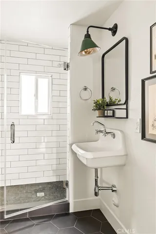 a bathroom with a sink and a mirror