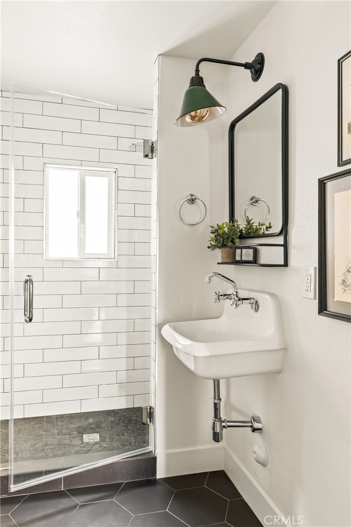 1149 Scenic Way Twin Peaks, CA 92391 - Photo 11 of 31 a bathroom with a sink and a mirror