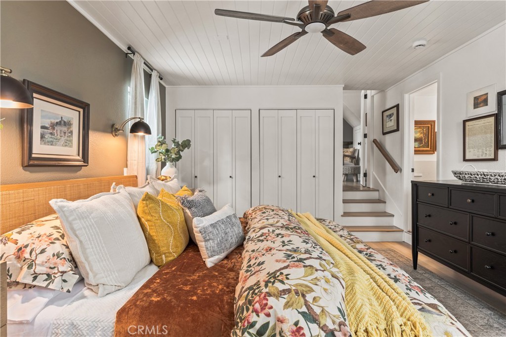 1149 Scenic Way Twin Peaks, CA 92391 - Photo 13 of 31 a bed room with a bed and a chandelier