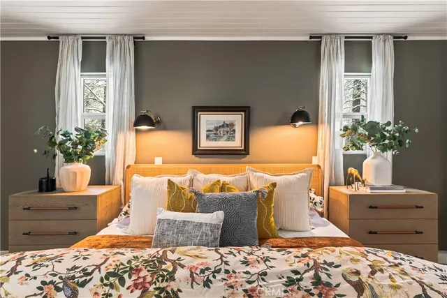 a living room with furniture and flowers