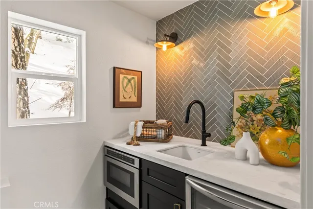 a view of a bathroom sink and a window