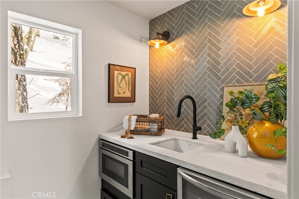 1149 Scenic Way Twin Peaks, CA 92391 - Photo 15 of 31 a view of a bathroom sink and a window