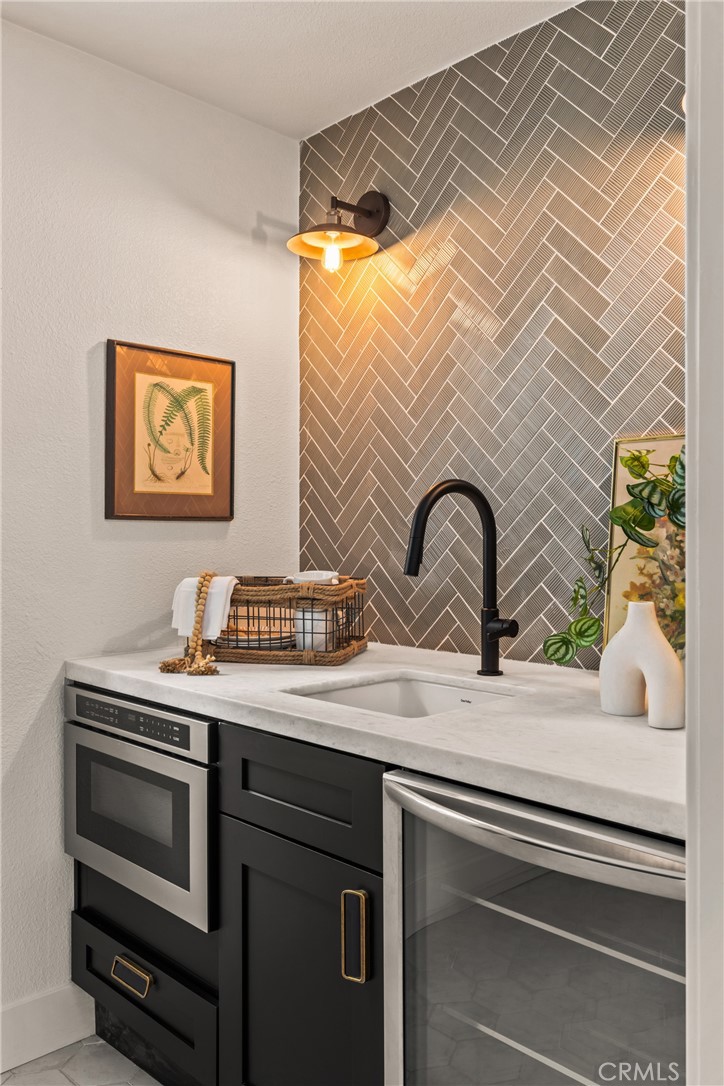 1149 Scenic Way Twin Peaks, CA 92391 - Photo 16 of 31 a sink and a microwave