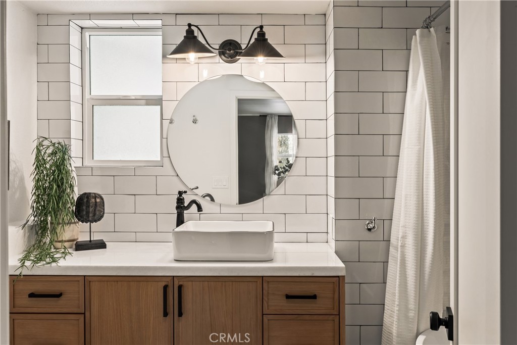 1149 Scenic Way Twin Peaks, CA 92391 - Photo 18 of 31 a bathroom with a sink and a mirror