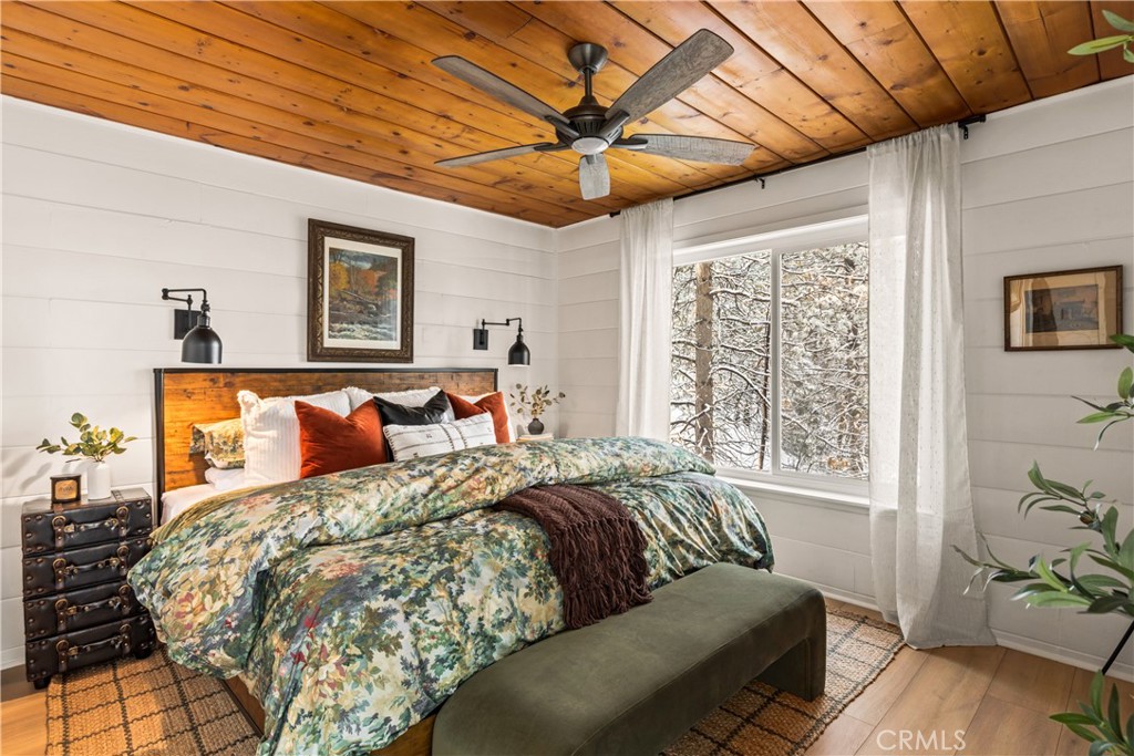 1149 Scenic Way Twin Peaks, CA 92391 - Photo 20 of 31 a bed room with a bed and a window