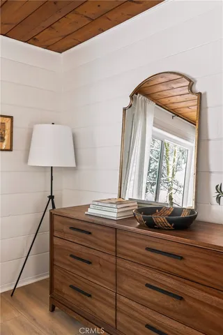 a view of room with window and wooden floor