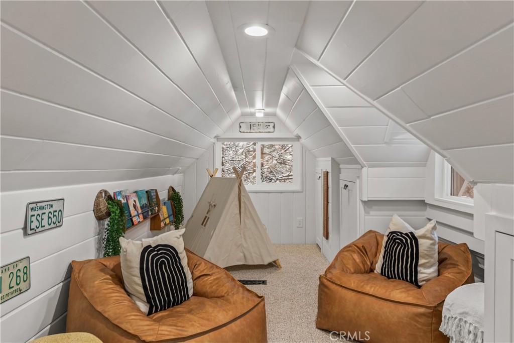 1149 Scenic Way Twin Peaks, CA 92391 - Photo 29 of 31 a living room with furniture and a chandelier