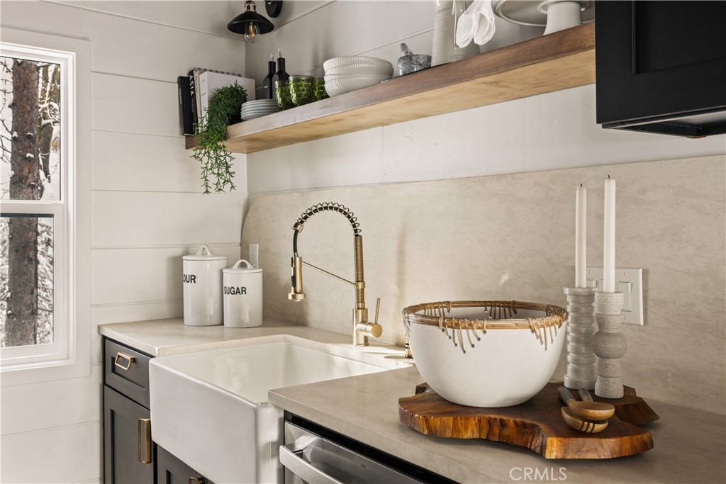 1149 Scenic Way Twin Peaks, CA 92391 - Photo 7 of 31 a room with a potted plant and a sink