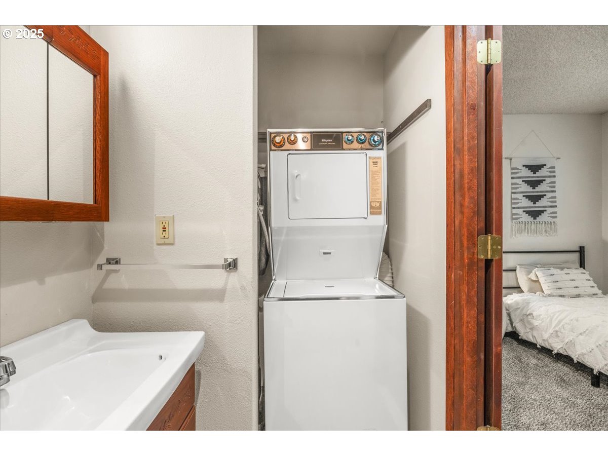 12612 Northwest Barnes Road, Unit 6 Portland, OR 97229 - Photo 17 of 40 a bathroom with a sink a toilet and shower