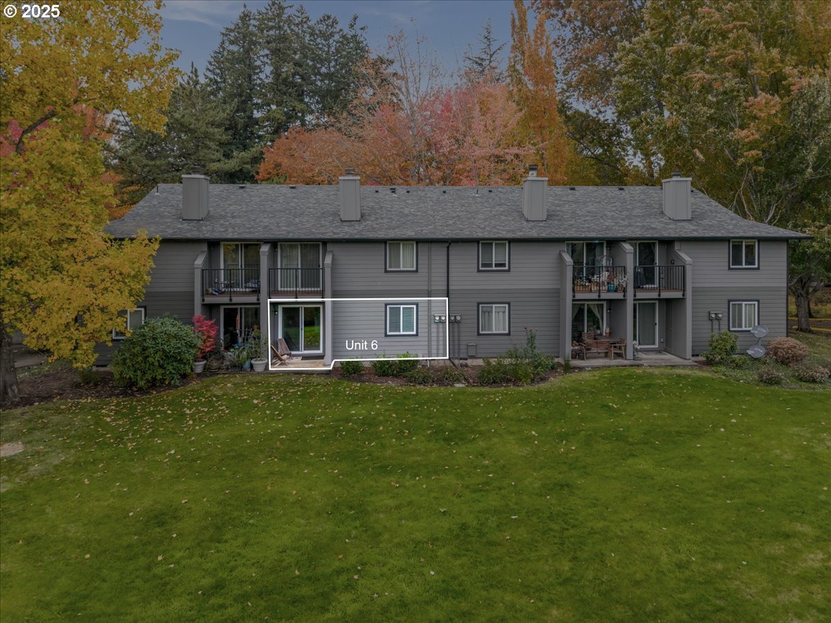 12612 Northwest Barnes Road, Unit 6 Portland, OR 97229 - Photo 26 of 40 a front view of a house with a garden