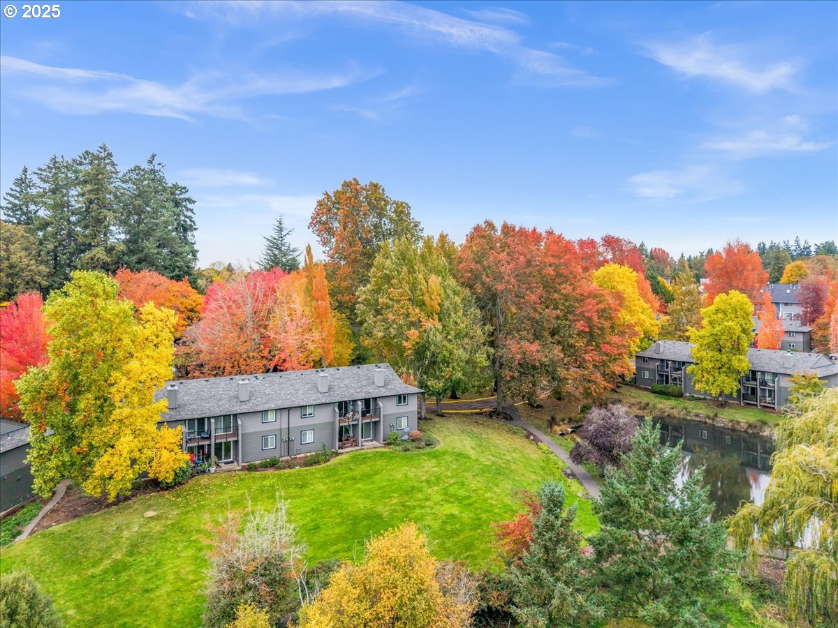 12612 Northwest Barnes Road, Unit 6 Portland, OR 97229 - Photo 28 of 40 a view of a house with a yard and a street view