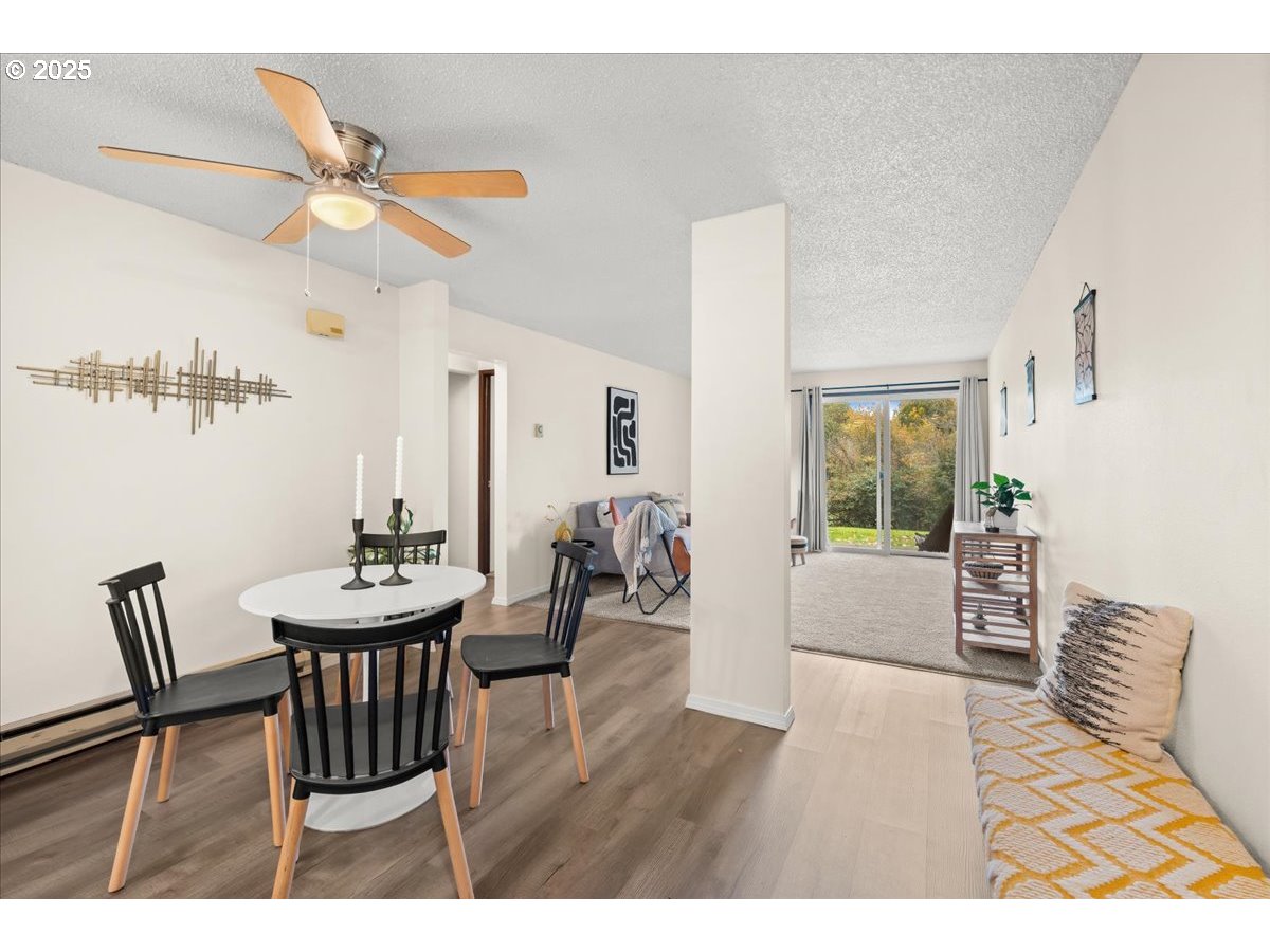 12612 Northwest Barnes Road, Unit 6 Portland, OR 97229 - Photo 5 of 40 a living room with furniture and a table
