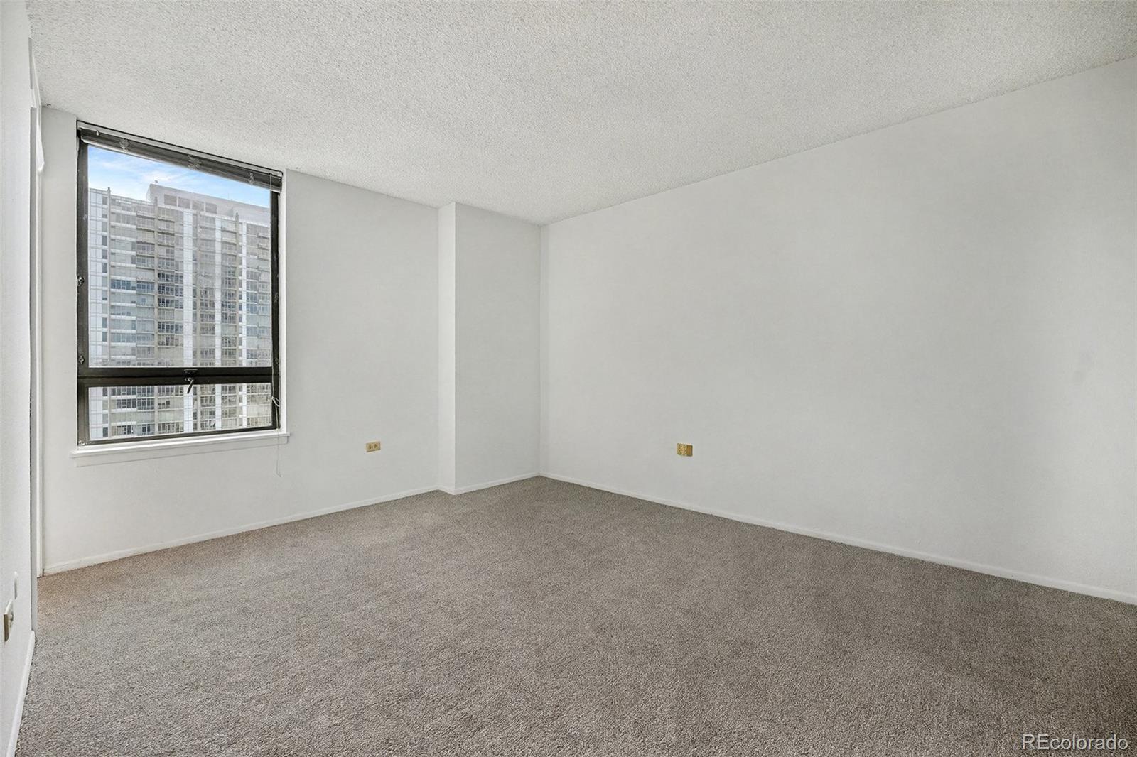 1020 15th Street, Unit 35L Denver, CO 80202 - Photo 12 of 39 a view of an empty room with a window