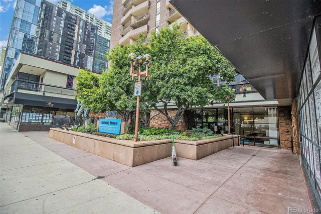 a view of a patio with chairs and tables