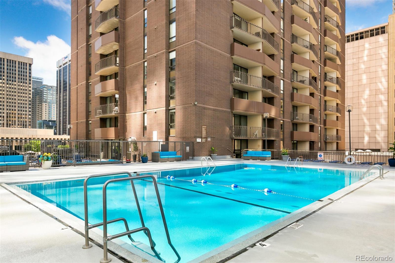 1020 15th Street, Unit 35L Denver, CO 80202 - Photo 31 of 39 a swimming pool with outdoor seating and yard