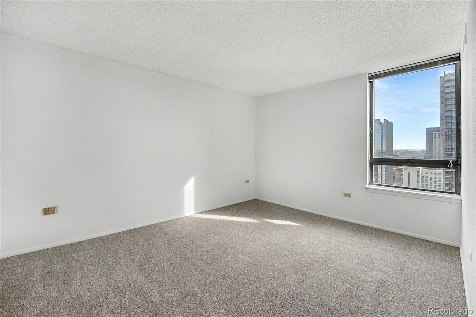 1020 15th Street, Unit 35L Denver, CO 80202 - Photo 10 of 39 a view of an empty room with a window