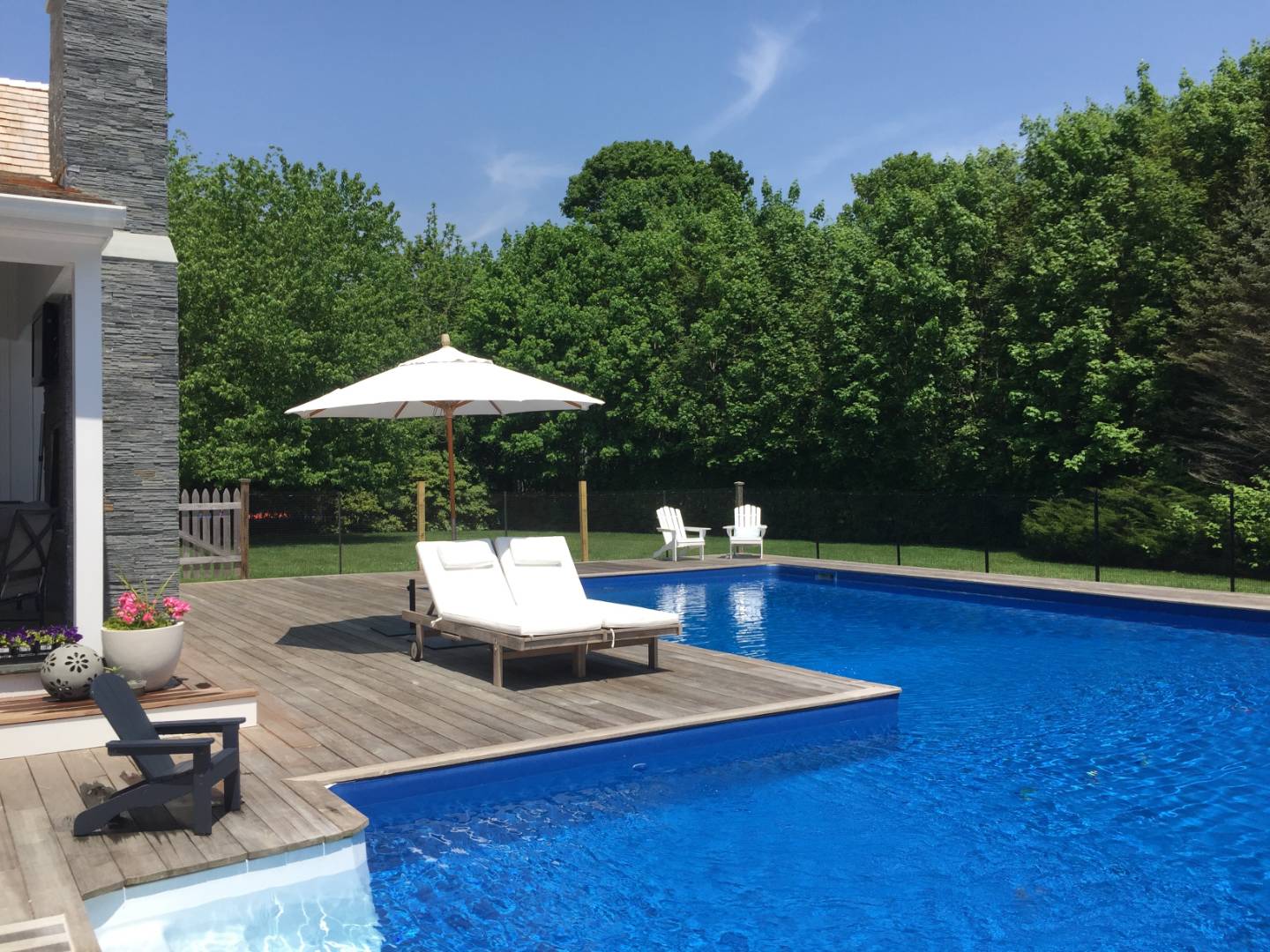 14 Aelfie's Way Bridgehampton, NY 11932 - Photo 12 of 13 a view of pool with lawn chairs and plants