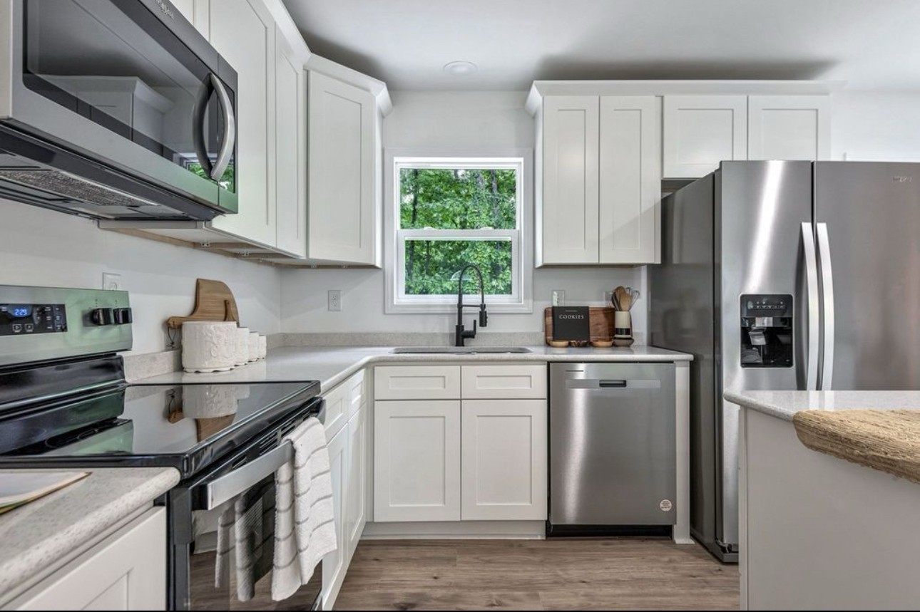 10498 Missionary Ridge Road Bon Aqua, TN 37025 - Photo 16 of 41 a kitchen with a sink stove and refrigerator