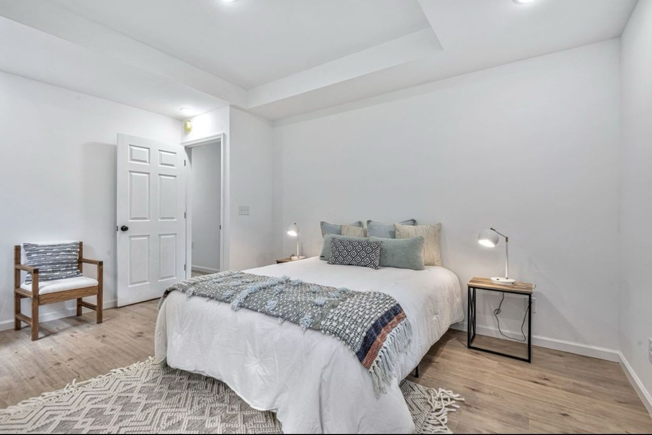 10498 Missionary Ridge Road Bon Aqua, TN 37025 - Photo 21 of 41 a bedroom with a bed and chair