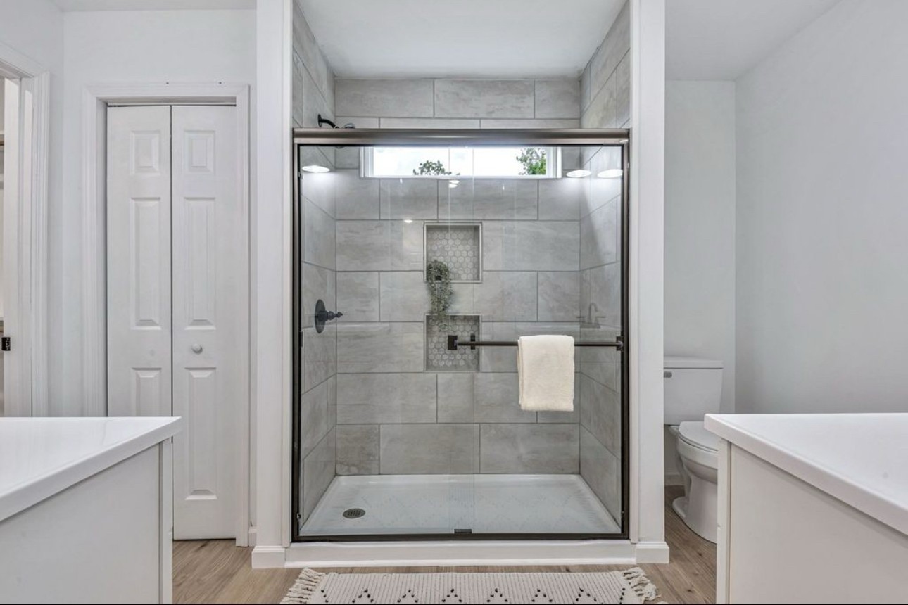 10498 Missionary Ridge Road Bon Aqua, TN 37025 - Photo 24 of 41 a bathroom with a glass shower door