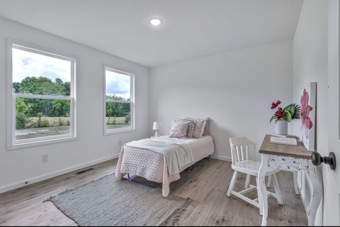 10498 Missionary Ridge Road Bon Aqua, TN 37025 - Photo 27 of 41 a living room with a bed furniture and a window