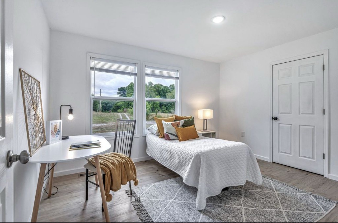 10498 Missionary Ridge Road Bon Aqua, TN 37025 - Photo 28 of 41 a bedroom with a bed and large windows