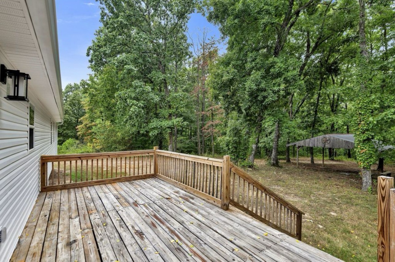 10498 Missionary Ridge Road Bon Aqua, TN 37025 - Photo 32 of 41 a view of a wooden deck with a yard