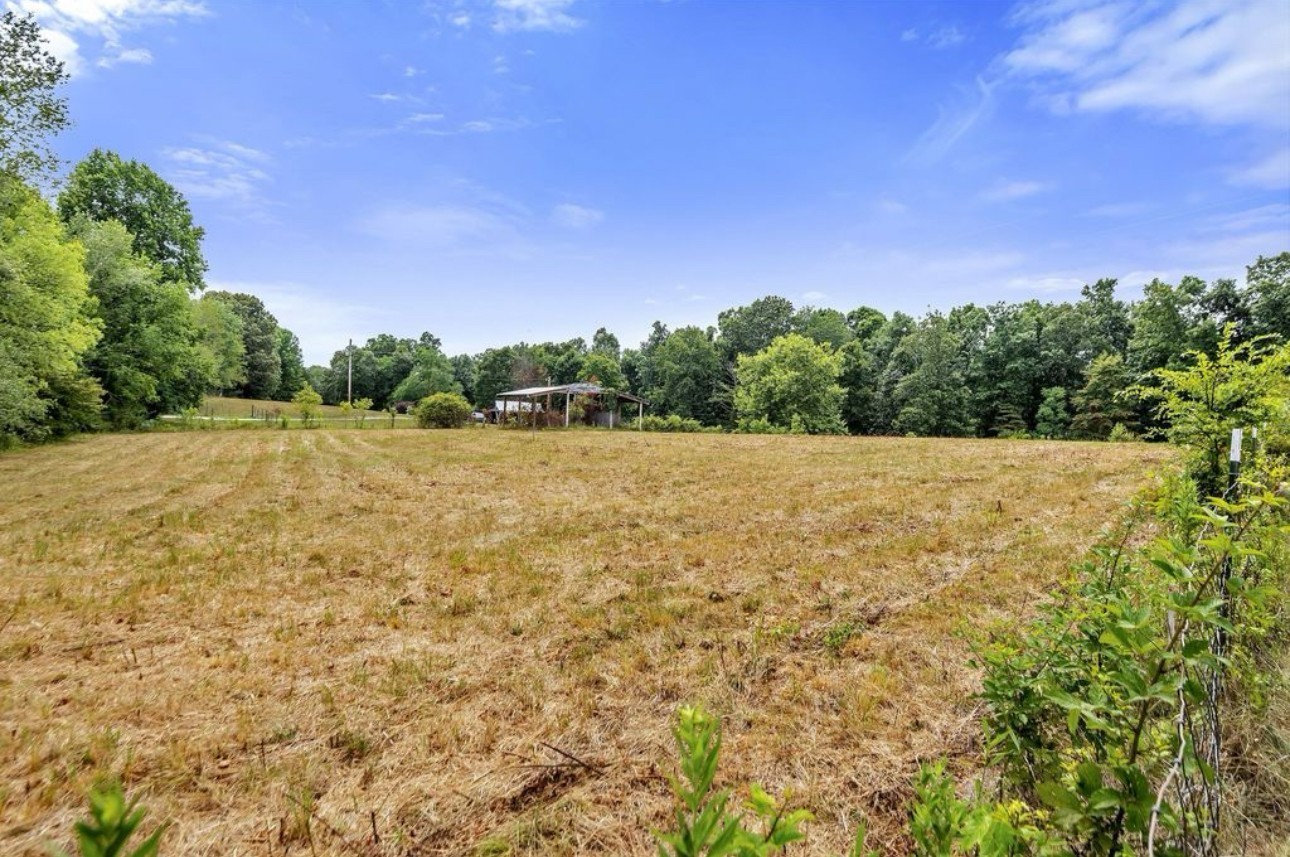 10498 Missionary Ridge Road Bon Aqua, TN 37025 - Photo 37 of 41 a view of a field with trees in the background