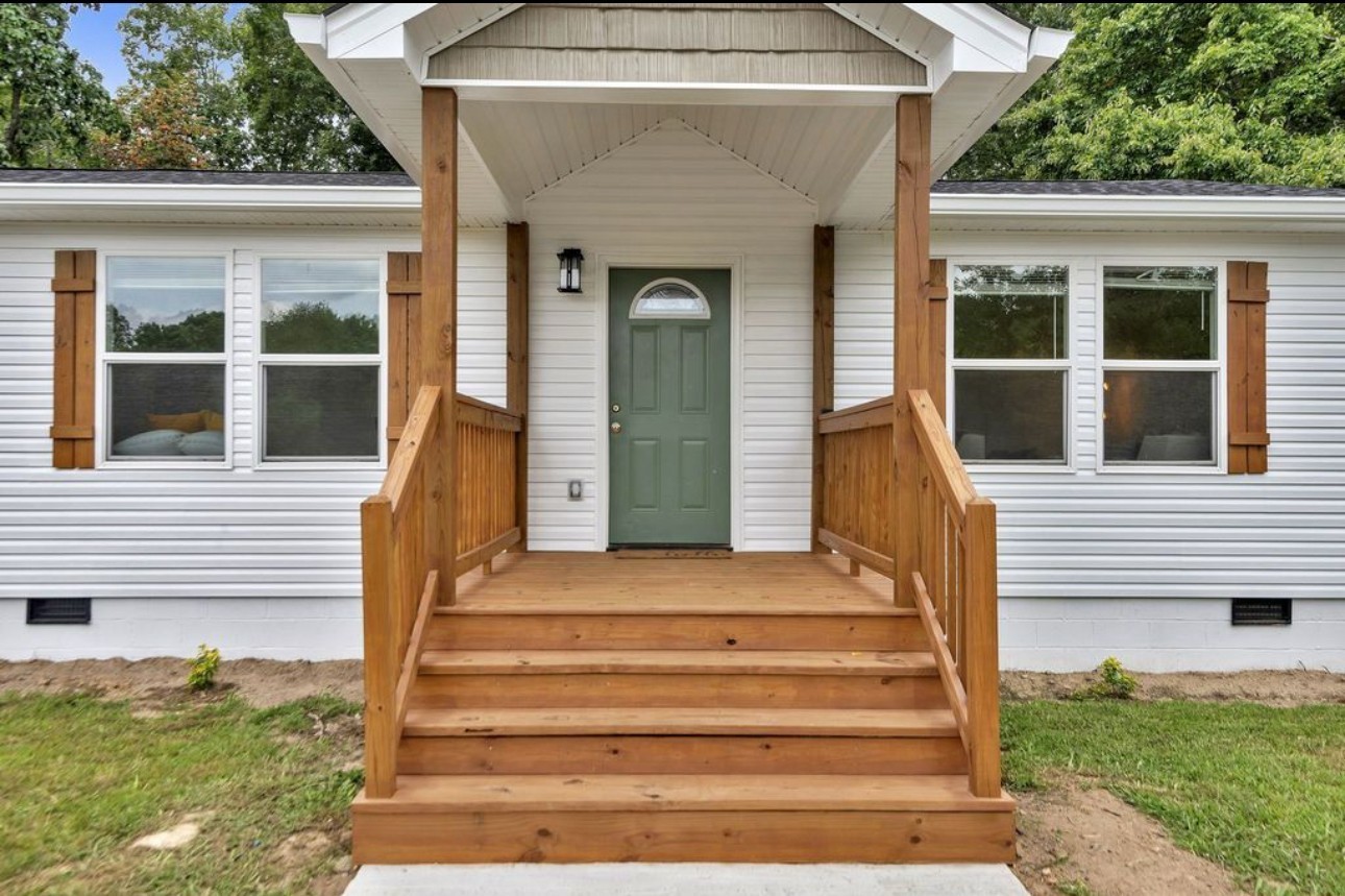 10498 Missionary Ridge Road Bon Aqua, TN 37025 - Photo 5 of 41 a front view of a house with a garden