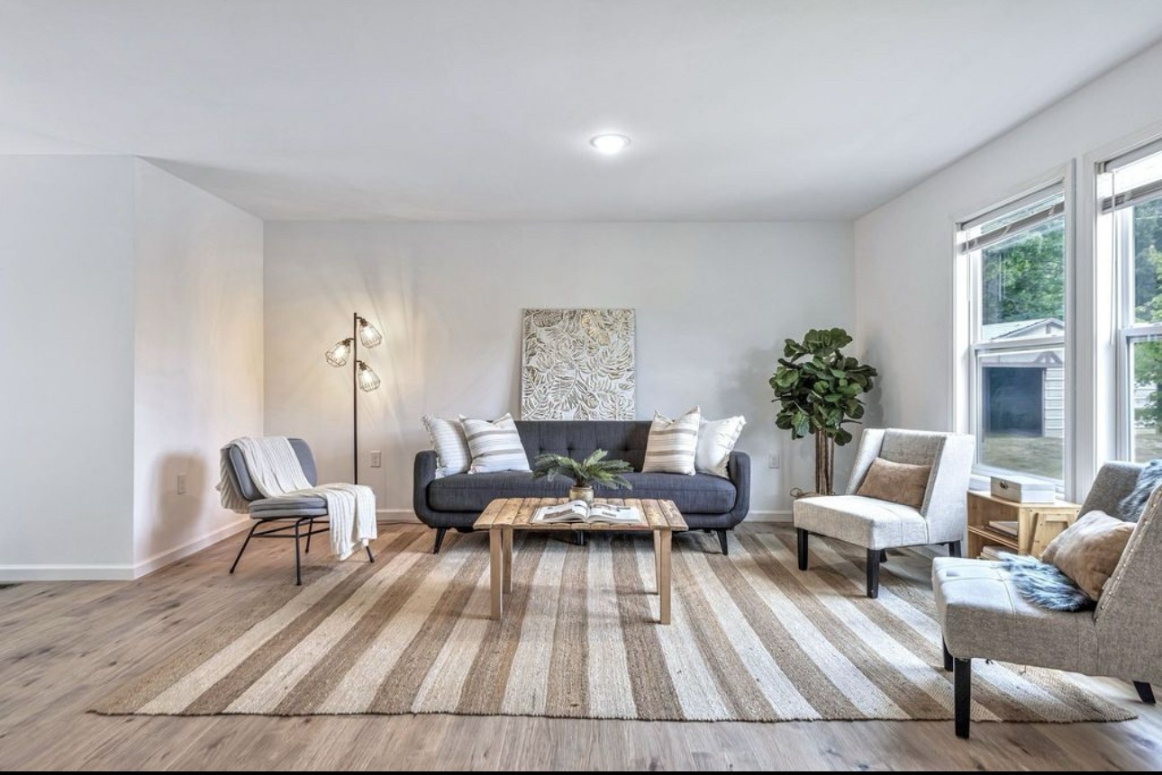 10498 Missionary Ridge Road Bon Aqua, TN 37025 - Photo 9 of 41 a living room with furniture and floor to ceiling windows