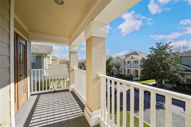 a view of a balcony with wooden floor