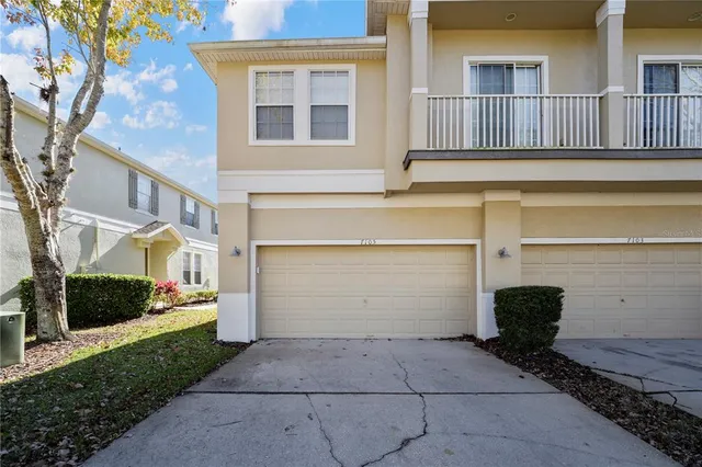 a front view of a house with garage