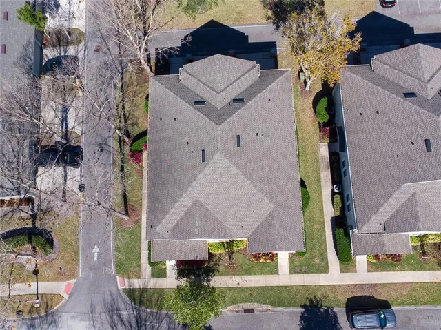 an aerial view of houses with outdoor space