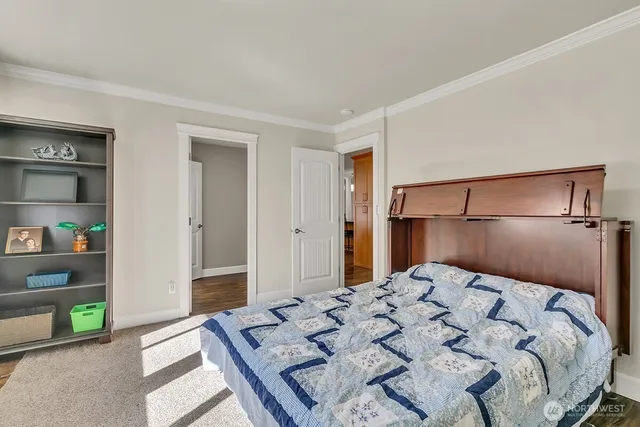 a bedroom with a bed and a cabinets