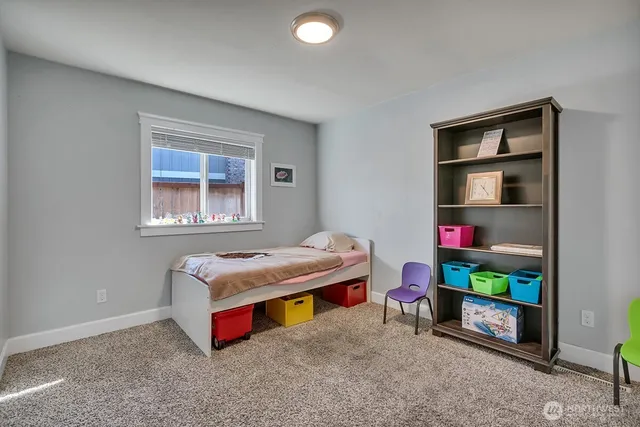 a room with pool table and window