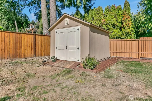 a view of a backyard of the house