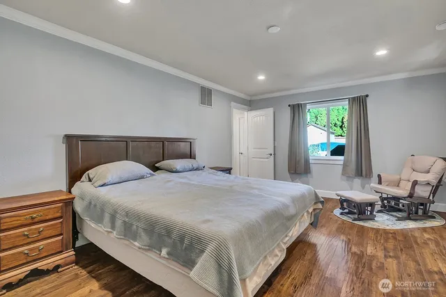 a bedroom with a bed and window