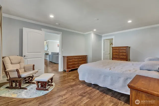 a bedroom with a bed and chair