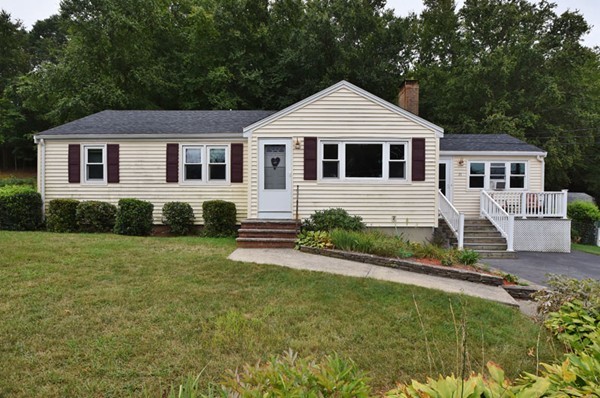 25 Grace Road Woburn, MA 01801 - Photo 1 of 14 a front view of a house with a yard