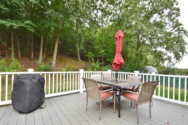 25 Grace Road Woburn, MA 01801 - Photo 11 of 14 a view of a chairs and table in the roof deck