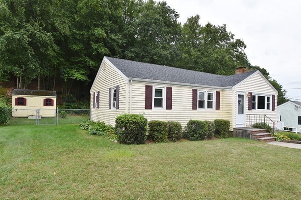 25 Grace Road Woburn, MA 01801 - Photo 13 of 14 a front view of a house with a garden