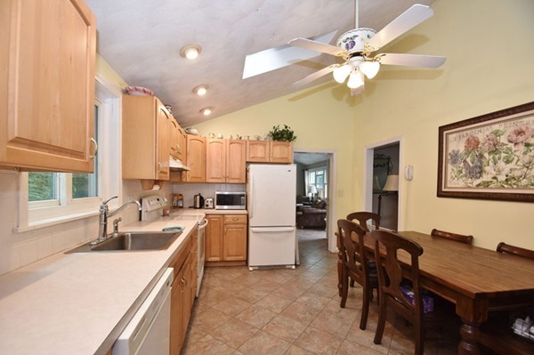 25 Grace Road Woburn, MA 01801 - Photo 3 of 14 a large kitchen with a table and chairs