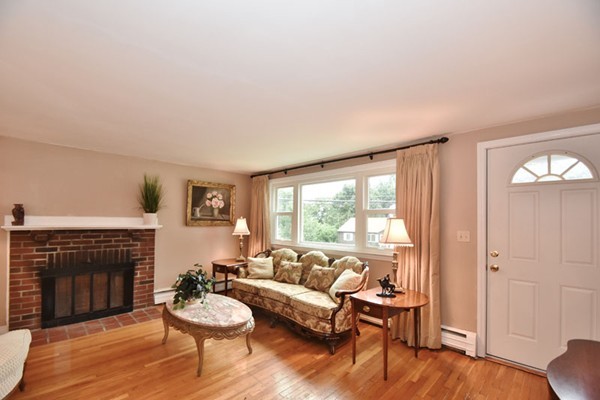 25 Grace Road Woburn, MA 01801 - Photo 5 of 14 a living room with furniture and a fireplace