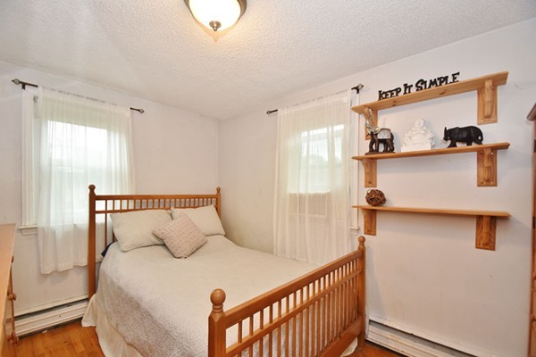 25 Grace Road Woburn, MA 01801 - Photo 9 of 14 a bedroom with a bed and a window